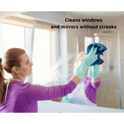 Woman in purple shirt cleaning a mirror